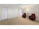 Comfortable room with neutral carpet, and natural light creating a welcoming atmosphere with seating area at 700 Beach Ne Dr # 606, St Petersburg, FL 33701