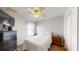 A bright bedroom featuring wood floors and a closet at 7010 Kendall Heath Way, Land O Lakes, FL 34637