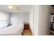 A bedroom featuring wood floors and a closet at 7010 Kendall Heath Way, Land O Lakes, FL 34637