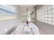 Bright dining area leads to lanai with sliding glass doors at 7010 Kendall Heath Way, Land O Lakes, FL 34637