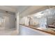 Well-lit kitchen featuring stainless steel appliances, tiled floors, and breakfast bar at 7010 Kendall Heath Way, Land O Lakes, FL 34637