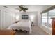 Spacious main bedroom with a large window, closet and plush carpeting at 7010 Kendall Heath Way, Land O Lakes, FL 34637