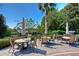 Outdoor patio with tables and chairs at 7010 Kendall Heath Way, Land O Lakes, FL 34637