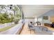 Enclosed patio with lots of space for lounging with tile floors and a ceiling fan at 7010 Kendall Heath Way, Land O Lakes, FL 34637