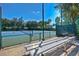Enjoy a match on the community's well-maintained tennis court surrounded by lush greenery at 7010 Kendall Heath Way, Land O Lakes, FL 34637