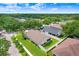 Aerial view showcasing a home nestled within a community of lush, mature trees, offering a serene setting at 7101 Bucks Ford Dr, Riverview, FL 33578