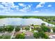 Gorgeous aerial view of homes on a lake with blue skies and clouds at 7101 Bucks Ford Dr, Riverview, FL 33578