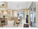 Dining room featuring a chandelier, sliding glass doors, and a bay window at 7101 Bucks Ford Dr, Riverview, FL 33578