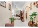Inviting entryway with neutral tile floors, arched doorways, and views of a cozy living space with fireplace at 7101 Bucks Ford Dr, Riverview, FL 33578