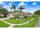 Charming single-story home with lush landscaping, a well-manicured lawn, and a two-car garage enhancing curb appeal at 7101 Bucks Ford Dr, Riverview, FL 33578
