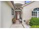 Welcoming front entrance with brick accents, decorative door, and landscaped garden enhancing curb appeal at 7101 Bucks Ford Dr, Riverview, FL 33578