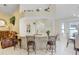 Open kitchen offers granite counters, brick accents, and seating at the counter at 7101 Bucks Ford Dr, Riverview, FL 33578