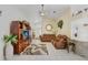 Open-concept living room with tile flooring, comfortable furnishings, and access to a breakfast bar at 7101 Bucks Ford Dr, Riverview, FL 33578