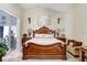 Cozy main bedroom with elegant furnishings and sliding glass doors at 7101 Bucks Ford Dr, Riverview, FL 33578