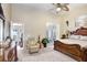 Main bedroom with large windows, seating area, and access to the lanai at 7101 Bucks Ford Dr, Riverview, FL 33578