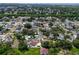 Aerial view showcases residential area with tree-lined streets, manicured lawns, and community setting at 7111 Lawnview Ct, Tampa, FL 33615