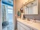 Bright bathroom with a vanity, mirror, and shower for personal care and convenience at 7111 Lawnview Ct, Tampa, FL 33615