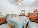 Inviting bedroom with a ceiling fan, warm decor, and comfortable furnishings for a restful retreat at 7111 Lawnview Ct, Tampa, FL 33615