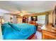 Primary bedroom with blue bedding, and hardwood flooring at 7111 Lawnview Ct, Tampa, FL 33615