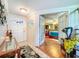 Inviting home entryway with stylish decor and a glimpse into the Primary bedroom at 7111 Lawnview Ct, Tampa, FL 33615