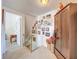 Hallway featuring a closet and staircase adorned with Gathering photos and carpeted flooring at 7111 Lawnview Ct, Tampa, FL 33615