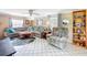 Comfortable living room with neutral tones, tile floors, and lots of natural light at 7111 Lawnview Ct, Tampa, FL 33615