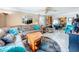 Open concept living room with comfortable seating, tile floors, and a seamless flow to other spaces at 7111 Lawnview Ct, Tampa, FL 33615