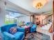 Comfortable living room with plush armchairs, large windows, and stylish decor at 7111 Lawnview Ct, Tampa, FL 33615