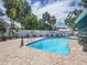 Beautiful pool surrounded by tile patio and well-maintained landscaping at 7111 Lawnview Ct, Tampa, FL 33615