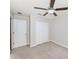 Bright bedroom with a ceiling fan, closet, neutral walls, and carpet flooring at 7211 Ozello Trail Ave, Sun City Center, FL 33573