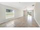 Bright and airy living room with tile flooring and sliding glass doors leading to the backyard at 7211 Ozello Trail Ave, Sun City Center, FL 33573
