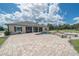 Backyard view featuring a luxurious pool, spa, and spacious patio at 7301 Loghouse Rd, Plant City, FL 33565
