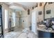 Stunning bathroom featuring granite counters, dual sinks, and a walk-in shower at 7301 Loghouse Rd, Plant City, FL 33565