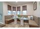 Bright breakfast nook with banquette seating and large windows for ample natural light at 7301 Loghouse Rd, Plant City, FL 33565