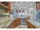 Charming breakfast nook with banquette seating, granite countertops, and scenic views at 7301 Loghouse Rd, Plant City, FL 33565