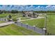 View of the house with a circular driveway, a large lawn, and mature landscaping at 7301 Loghouse Rd, Plant City, FL 33565