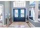 Grand foyer with decorative tile and double doors leading to main living area at 7301 Loghouse Rd, Plant City, FL 33565