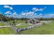 Beautifully landscaped home featuring a pond with a gazebo and a circular driveway at 7301 Loghouse Rd, Plant City, FL 33565