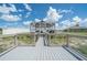 Outdoor gazebo with ample seating, a lovely place to relax and enjoy the view of the home and pond at 7301 Loghouse Rd, Plant City, FL 33565