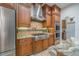 Gourmet kitchen with professional-grade stainless steel appliances and custom cabinetry at 7301 Loghouse Rd, Plant City, FL 33565