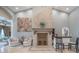 The living room includes a stone fireplace, neutral paint, travertine floors, and an ornate bar area at 7301 Loghouse Rd, Plant City, FL 33565