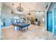 Open floor plan featuring travertine flooring, a pool table, and custom lighting at 7301 Loghouse Rd, Plant City, FL 33565