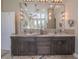 The main bathroom features a vanity with double sinks and a large mirror at 7301 Loghouse Rd, Plant City, FL 33565