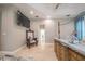 This main bedroom features a TV, a sitting area, and a unique dresser at 7301 Loghouse Rd, Plant City, FL 33565