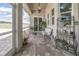 Relax on this screened patio with ample seating and lush greenery at 7301 Loghouse Rd, Plant City, FL 33565