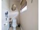 Charming powder room featuring neutral walls and tile floors at 7301 Loghouse Rd, Plant City, FL 33565