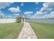 A charming storage shed nestled in a well-maintained backyard, adding functionality and aesthetic appeal at 7301 Loghouse Rd, Plant City, FL 33565