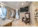 This sitting area has a view to the backyard with a large mirror at 7301 Loghouse Rd, Plant City, FL 33565