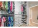 This walk-in closet has lots of space for hanging clothing, shoes, and accessories at 7301 Loghouse Rd, Plant City, FL 33565