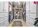 The walk-in closet has ample storage space for clothes and shoes at 7301 Loghouse Rd, Plant City, FL 33565